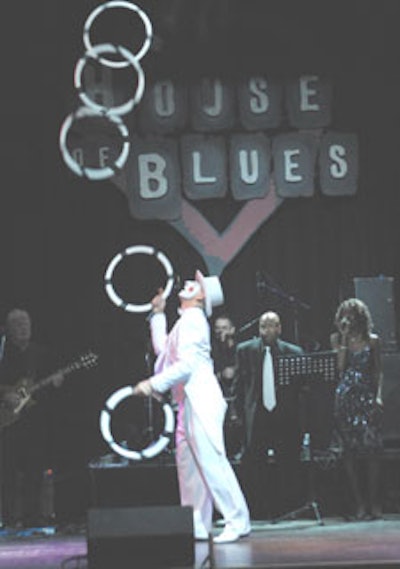 A member of Cirque du Soul juggled large, painted rings during one of the group's performances.