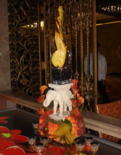Centerpieces in the main hall included exotic flowers and small statues, further enhancing the Asian theme.