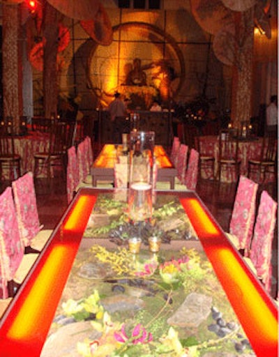 Long tables in the main hall encased a variety of flowers and greenery that were lit from below, adding a new dimension to the dining experience.