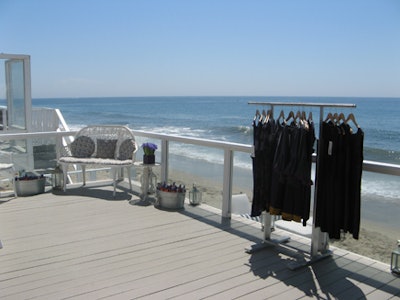 Pieces from French Connection's fall collection sat on the deck of the serene beach house.
