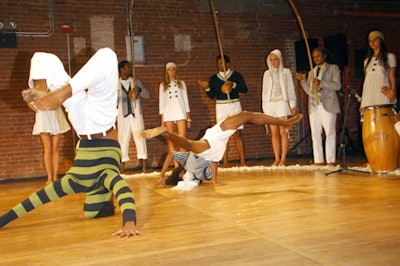 The event was more like a concert than a runway show; barefoot models joined the dancers in a semicircle in front of the stage.