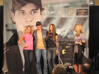 Crosby posed onstage with models from the fashion show.