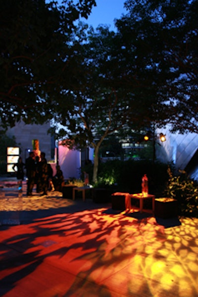 An outdoor lounge area featured abstract patterned lighting.