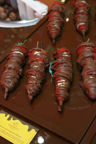 Fruit skewers dipped in Godiva chocolate were among the buffet of sweet offerings at the confectioner's lounge.