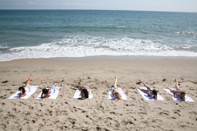 Guests took to the beach for Pilates.