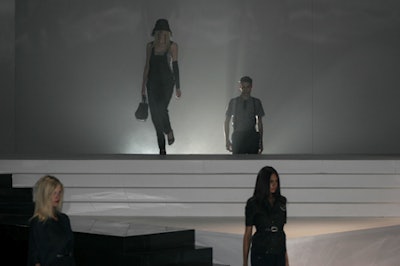 To give a different perspective, models emerged from behind a smoky-lit black-and-white backdrop.