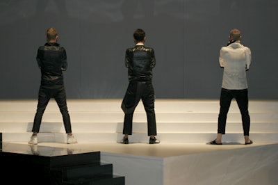 Another component of the show included models standing motionless at the rear of the stage.