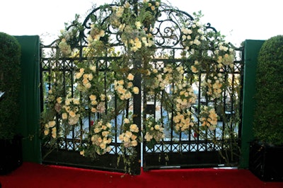 Roses covered an iron gate.