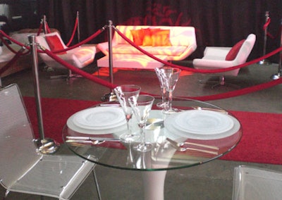 Flatware provided by Atlas Party Rental accentuated the Johnie dining table and Lola chairs created by Room Service.