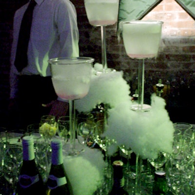 Dry ice smoke spilled from goblets at the bar.