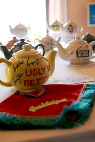 The teapot auction, which benefits the educational outreach programs of both organizations, ends on September 28.