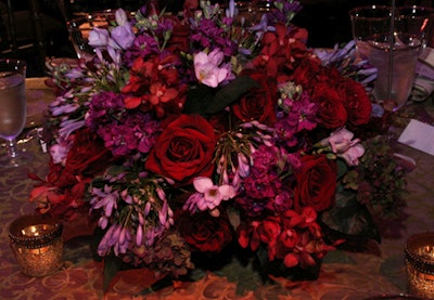 Jack Lucky provided the purple and red floral arrangements, which consisted of antique purple hydrangea, roses, delphinium, burgundy orchids, freesia, and alliums.