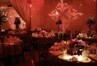 Event planners tied the gala's decor to La Bohème by using the damask pattern on the wallpaper in Act 2 as a motif on the tablecloths, programs, invitations, and light projections.