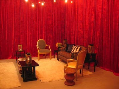 Furnishing by Corey’s floor-to-ceiling red velour draperies provided a backdrop for Chair-man Mills’ old-fashioned lounge furnishings.