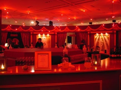Holt Renfrew’s in-house lighting team cast this satellite bar in a red glow.