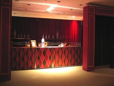 Pinney adorned this large wooden bar with vintage harlequin patterns.