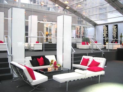 Sumptuous pillows accessorized plush white lounges in the Le Corbusier mode.