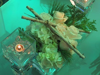 Rose and white flower centerpieces anchored every table.