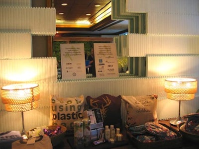 Eurolite light fixtures powered by eco-friendly Bullfrog Power illuminated tables of free merchandise.