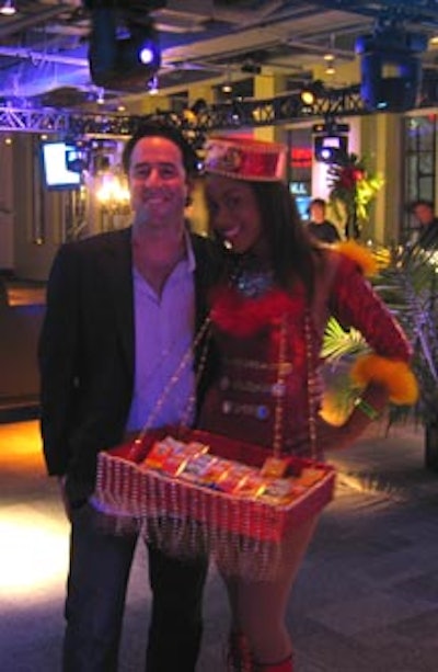 'Cigars, cigarettes?' This charming model in a cigarette girl costume from 3 Design passed out retro chocolate cigarettes to party guests.