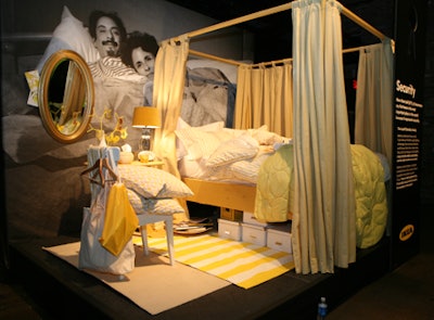 Planners arranged Ikea furniture into three vignettes. Oversize photographs of people featured in the film helped tie the product back to the message.