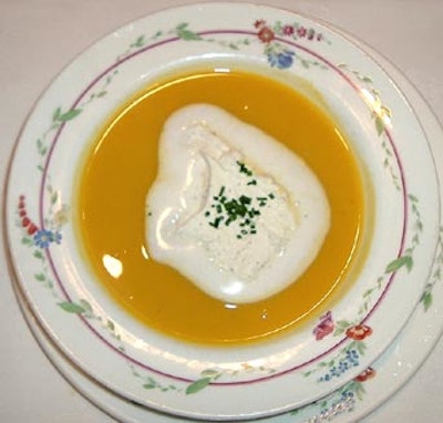 A helping of butternut squash bisque with nutmeg cream and chives opened the dinner menu.