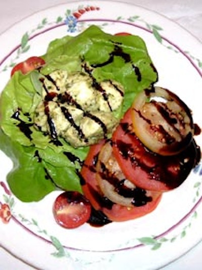The salad consisted of vine-ripened tomato and mozzarella with basil pesto and aged balsamic.
