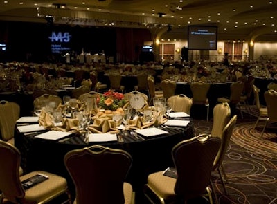 Large projection screens flanked the stage, displaying auction items as well as live video feeds of the presenters, including mistress of ceremonies Norah O'Donnell, MSNBC's chief Washington correspondent.