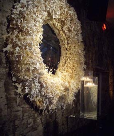 Candlelight illuminated the birch-bark-covered walls.