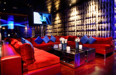 Blue pillows and lighting inside complemented a 50-foot stretch of blue carpet outside.