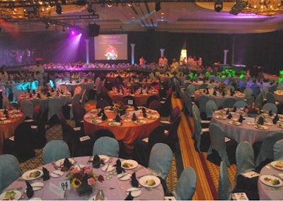 Vibrantly colored linens complimented by equally vibrant audiovisual transformed the Omni's National Ballroom into a scene reminiscent of a Las Vegas nightclub.
