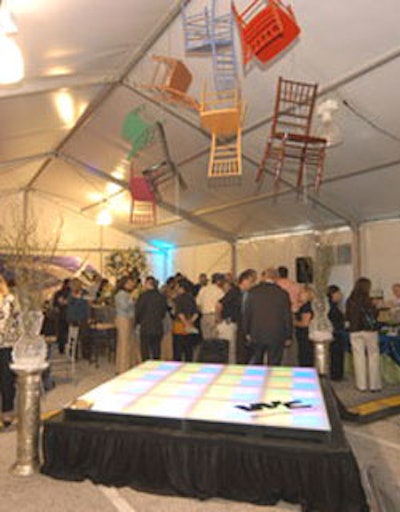 Inside the tent constructed by Prime Event Group, colorful chairs were suspended above the dance floor and stage.