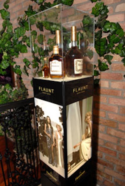 Glass-encased bottles of Hennessy were on display throughout the club atop tall stands wrapped in posters from the company's new advertising campaign, 'Flaunt Your Taste.'