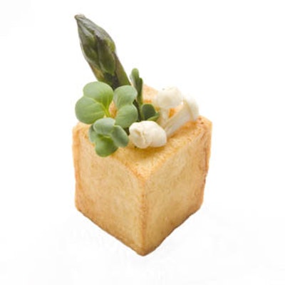 A saffron potato box filled with asparagus, enoki mushrooms, and radish sprouts, from Entertaining Ideas Catering in New York.