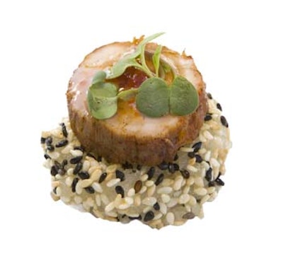 Plum-cured pork on a savory rice cake topped with sweet chili sauce from Robbins Wolfe Eventeurs in New York.