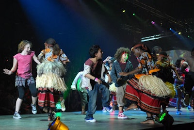 American kids met up with Ugandan dancers on the runway for a crowd-pleasing, multicultural performance.