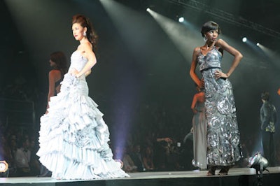 Models showed off specially designed silver duds (in honor of the event's silver anniversary), which were available for purchase at auction to benefit the Passport Fund.