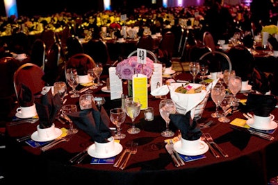 Black linens and rose centerpieces topped hundreds of tables.