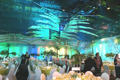 Event planners created a tropical Florida theme with lighting and custom props.