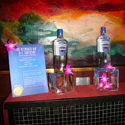 Plymouth Gin, who also supplied the pink specialty cocktails, topped an amber- and tortoiseshell-colored mosaic tile bar in the restaurant's lobby with three blue-lit Plymouth bottles.