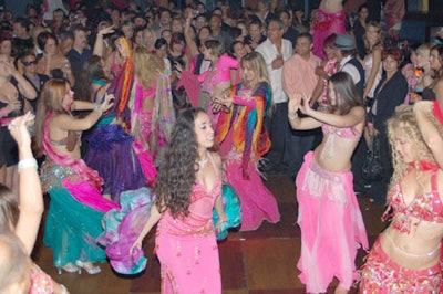 Clad in colorful Indian costumes, dancers from Dream Belly Dance Company swayed through the club dancing with partygoers.