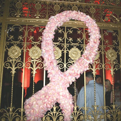 A giant pink cancer awareness ribbon composed of pink flowers greeted guests as they entered the main event space at the Dupont.