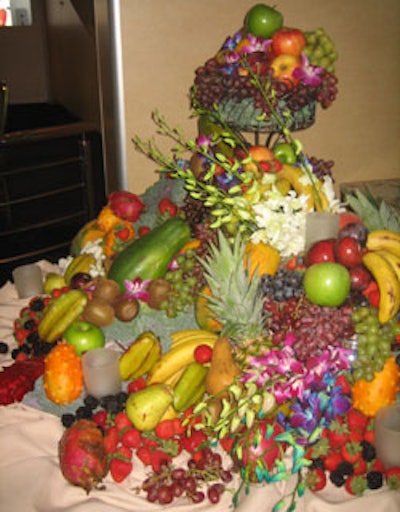 A mountain of cascading fruit doubled as a beautiful centerpiece and buffet section on the