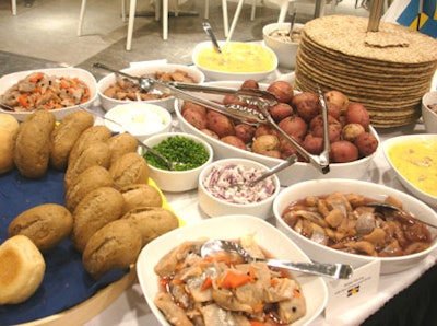 A variety of breads, sauces, dips, and fish selections were included in the buffet.