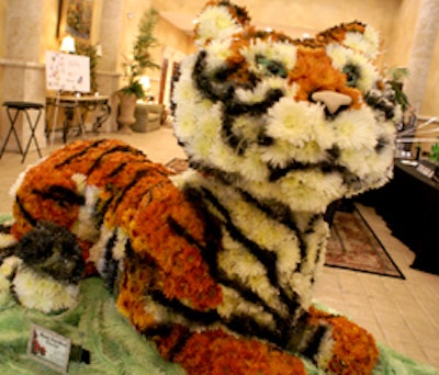 A large tiger, created entirely from various colored mums by Rose Garden Florist, greeted guests as they entered the A La Carte Event Pavilion.