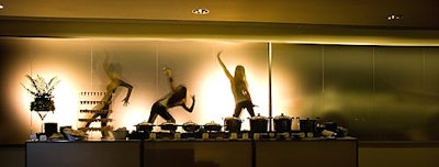 Dancers performed in silhouette behind a frosted glass wall at BMW Toronto Headquarters for the automaker's annual charity casino night.
