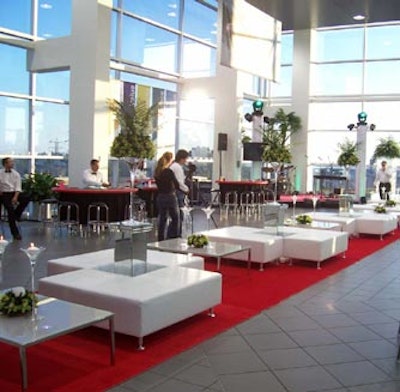 A red carpet, white sofas, and gaming tables transformed the fifth floor into a casino.