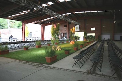 Aesthetics Earthworks provided a 20- by 80-foot sod runway, complete with potted trees and plants, for the Fashion Takes Action fund-raiser at Evergreen Brick Works.