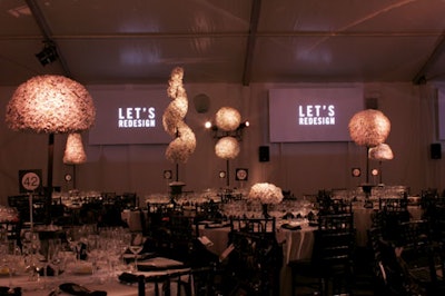 Flat-screen TVs at one end of the dining room flashed eco-friendly tips, tying into the evening's green theme.