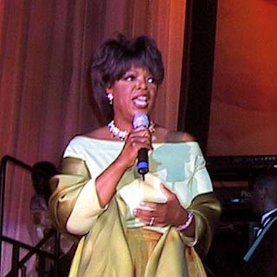 Oprah Winfrey greeted guests from the stage at the first anniversary party for her O magazine.